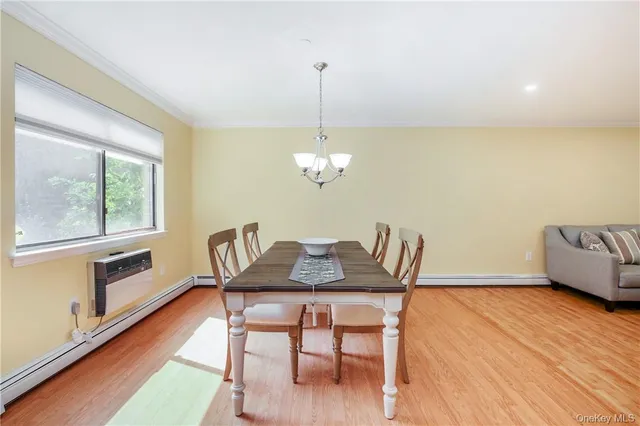 a dining room with furniture and window