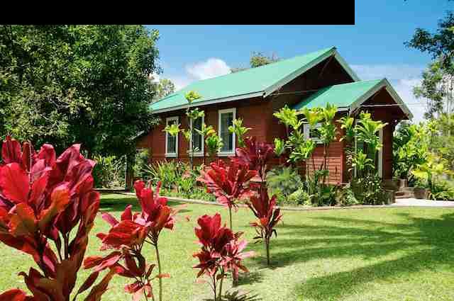 490 Kaupakalua Road Haiku, HI 96708 - Photo 1 of 30 a backyard of a house with lots of green space