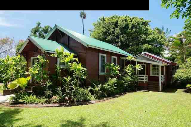 490 Kaupakalua Road Haiku, HI 96708 - Photo 15 of 30 a front view of house with yard and trees in the background