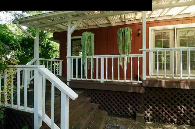 490 Kaupakalua Road Haiku, HI 96708 - Photo 26 of 30 a view of a house with porch and wooden floor