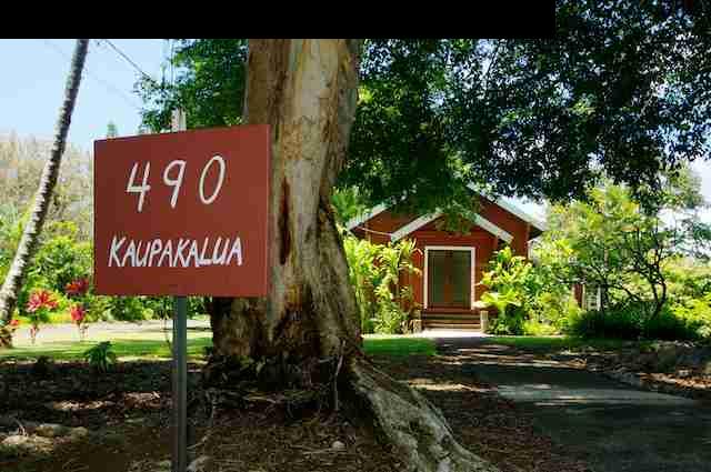 490 Kaupakalua Road Haiku, HI 96708 - Photo 9 of 30 a sign board with a house in the background