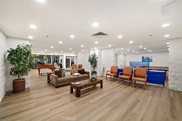 a room with furniture pool table and table soccer