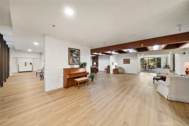 a living room with furniture a fireplace and a table