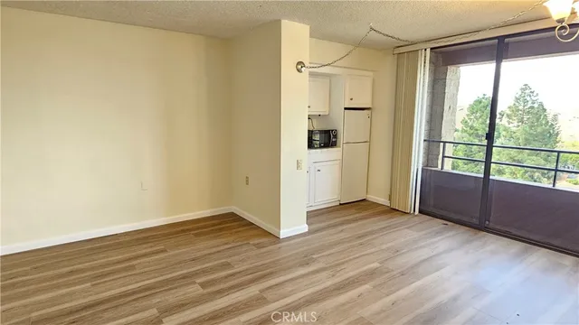 a view of wooden floor in an empty room