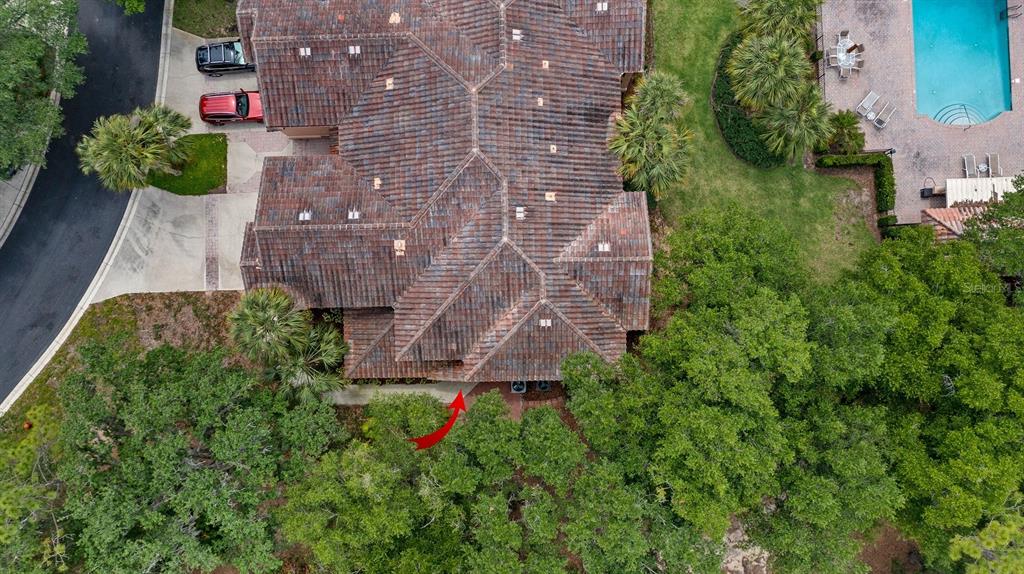 102 Camino Real, Unit 102 Howey-in-the-Hills, FL 34737 - Photo 35 of 62 a aerial view of a house with a yard and garden