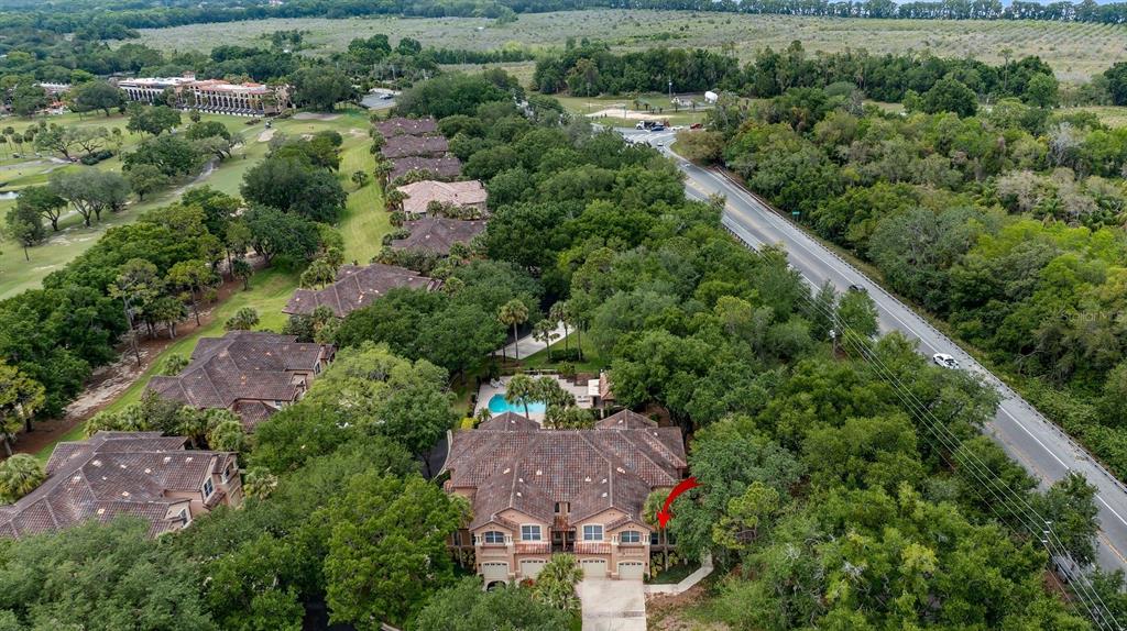 102 Camino Real, Unit 102 Howey-in-the-Hills, FL 34737 - Photo 37 of 62 an aerial view of house with yard