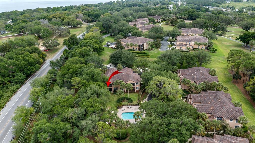 102 Camino Real, Unit 102 Howey-in-the-Hills, FL 34737 - Photo 38 of 62 an aerial view of a houses with outdoor space and street view