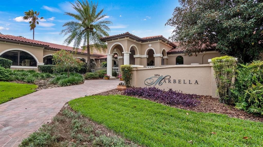 102 Camino Real, Unit 102 Howey-in-the-Hills, FL 34737 - Photo 47 of 62 a view of a house with a garden