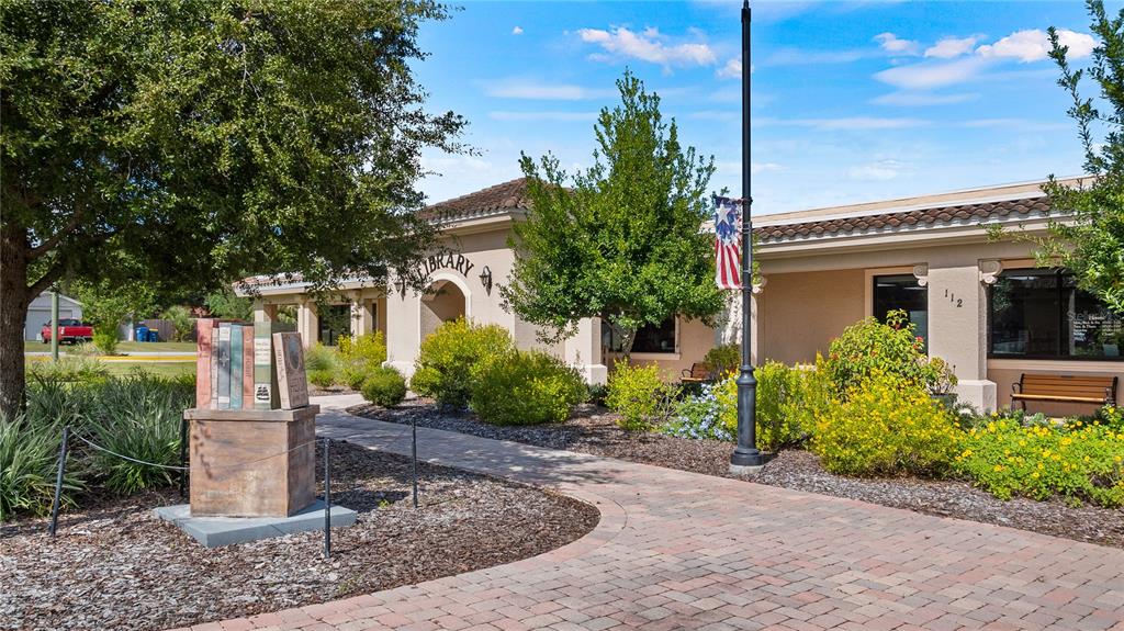 102 Camino Real, Unit 102 Howey-in-the-Hills, FL 34737 - Photo 61 of 62 a front view of a house with garden