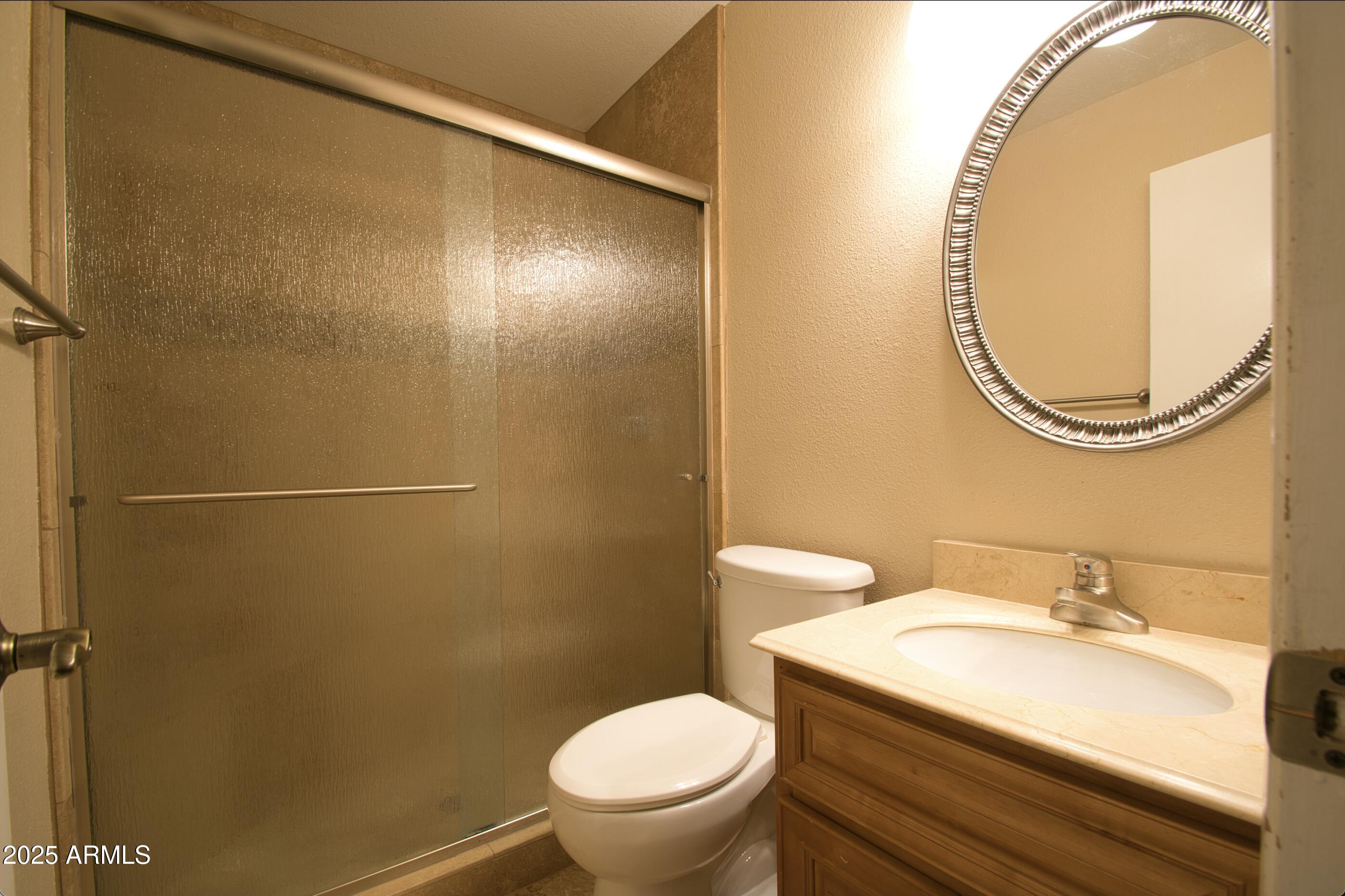 6018 North 79th Street Scottsdale, AZ 85250 - Photo 11 of 24 a bathroom with a sink and a mirror