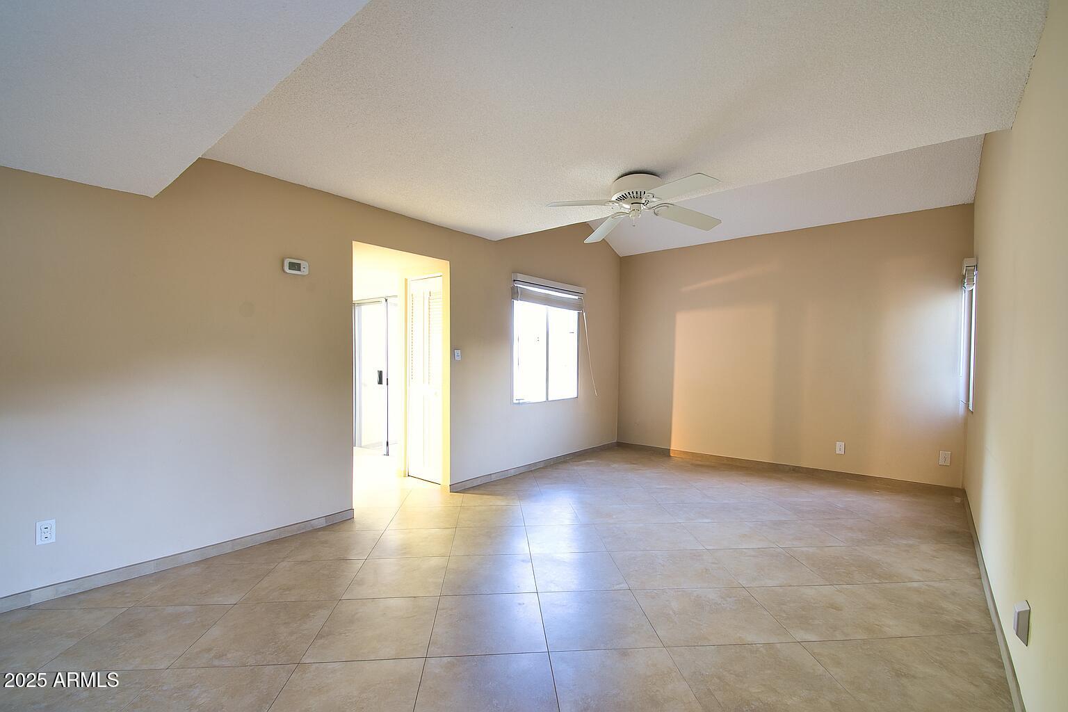 6018 North 79th Street Scottsdale, AZ 85250 - Photo 4 of 24 a view of an empty room with a window