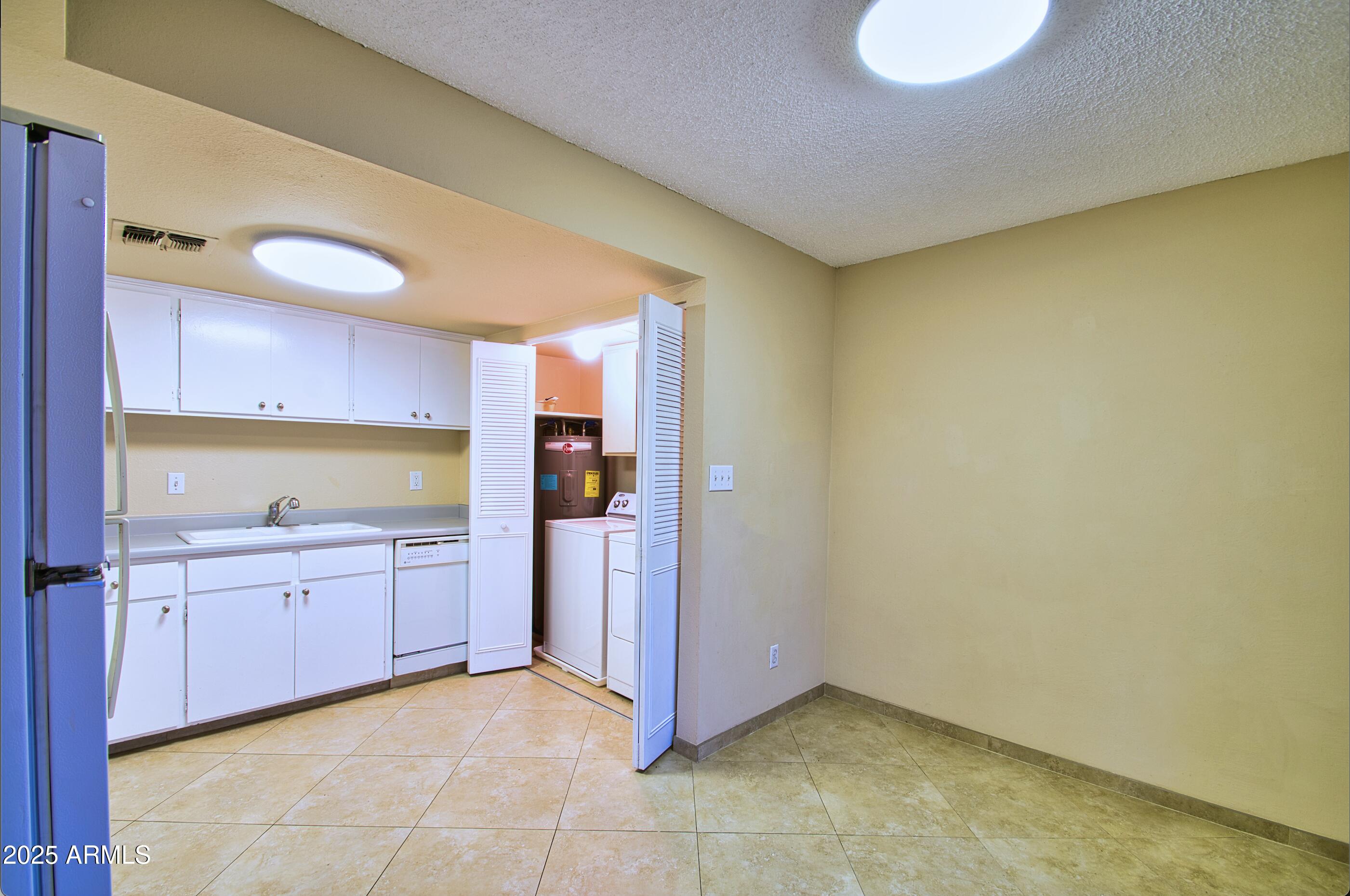 6018 North 79th Street Scottsdale, AZ 85250 - Photo 6 of 24 a view of a kitchen with a sink