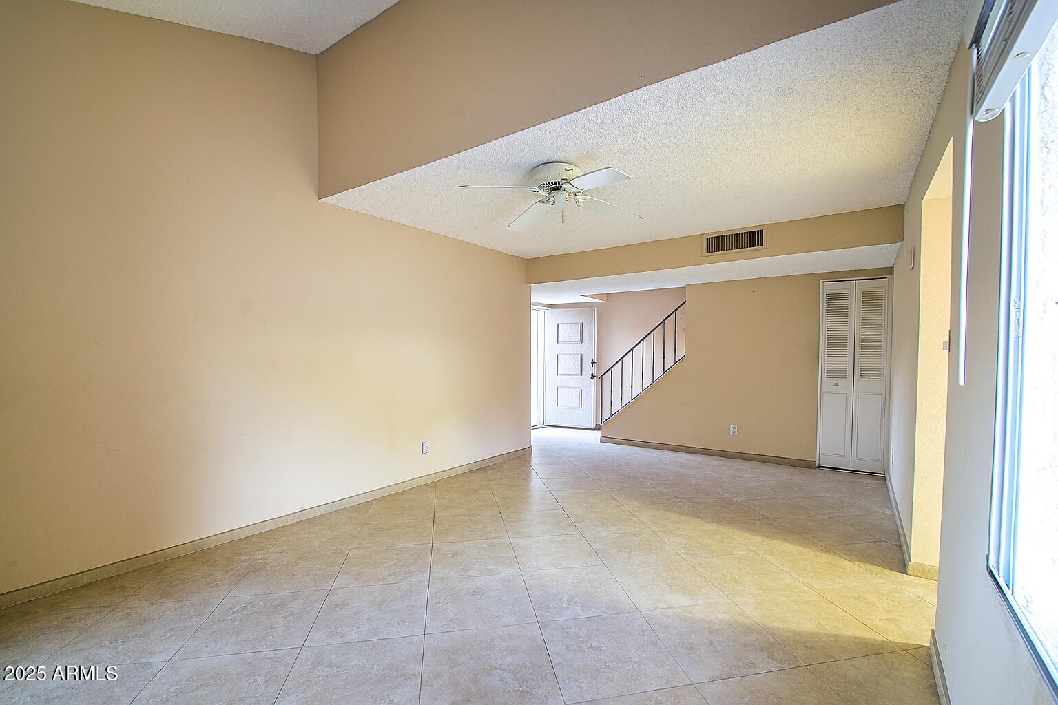 6018 North 79th Street Scottsdale, AZ 85250 - Photo 9 of 24 an empty room with a natural light