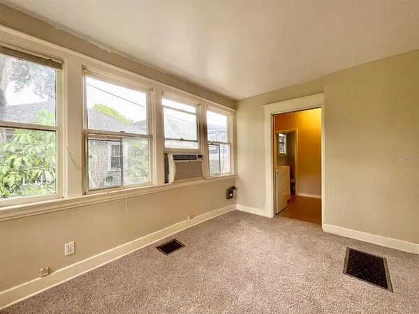 an empty room with windows