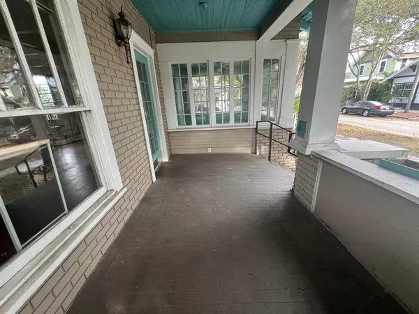 a view of an entryway with a floor to ceiling window