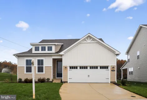 a view of a big house with a yard