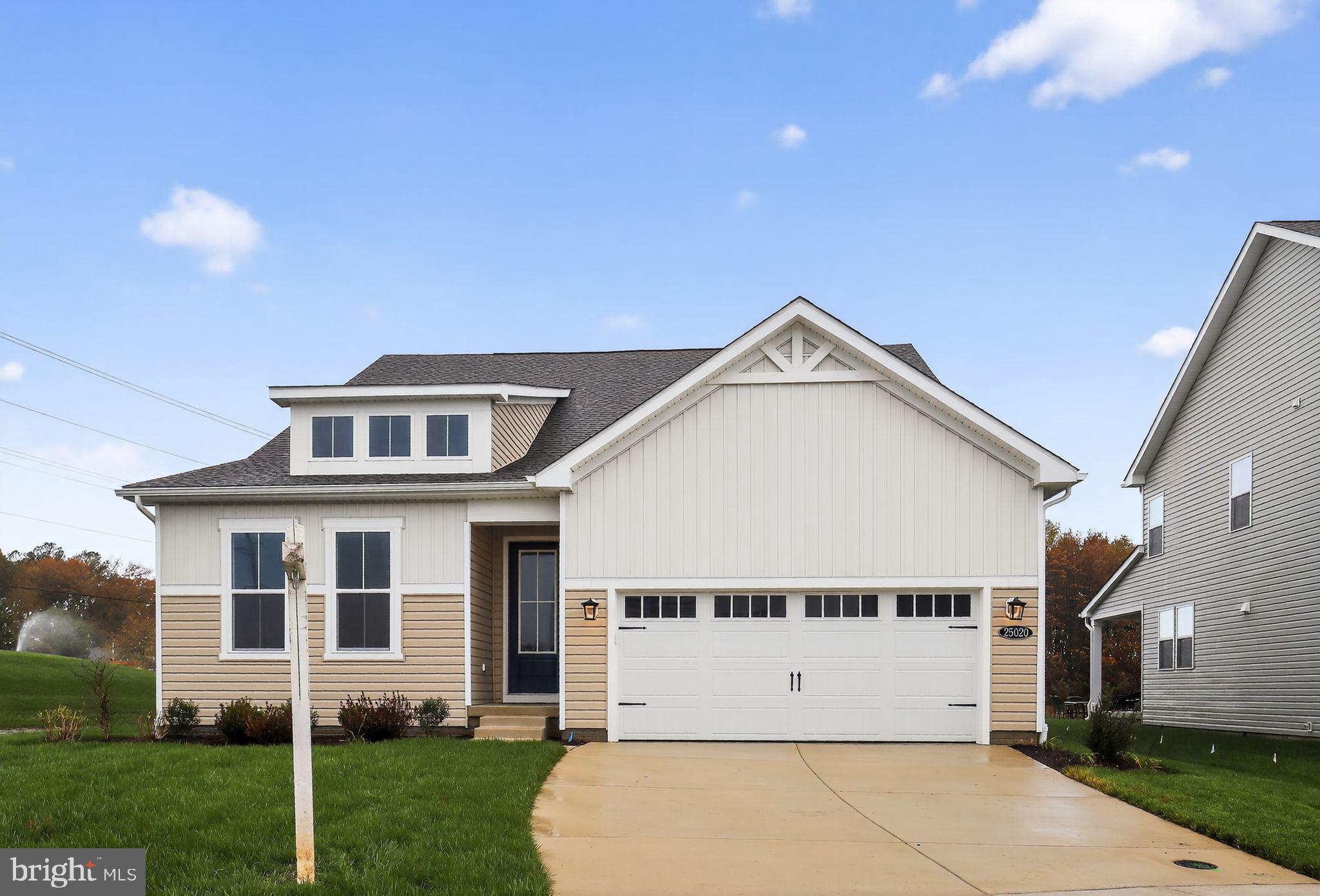 25020 Cypress Court Lewes, DE 19958 - Photo 1 of 21 a view of a big house with a yard