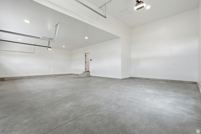 2970 North Mahogany Vly Road Logan, UT 84341 - Photo 34 of 39 Garage with recessed lighting and a garage door opener