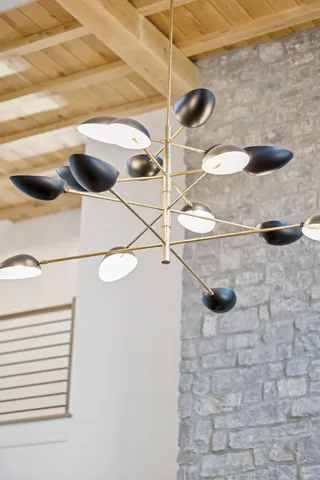 a bedroom with a bed a fireplace and a television