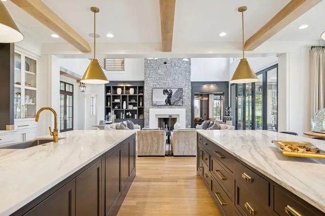 a kitchen with stainless steel appliances a sink and a refrigerator