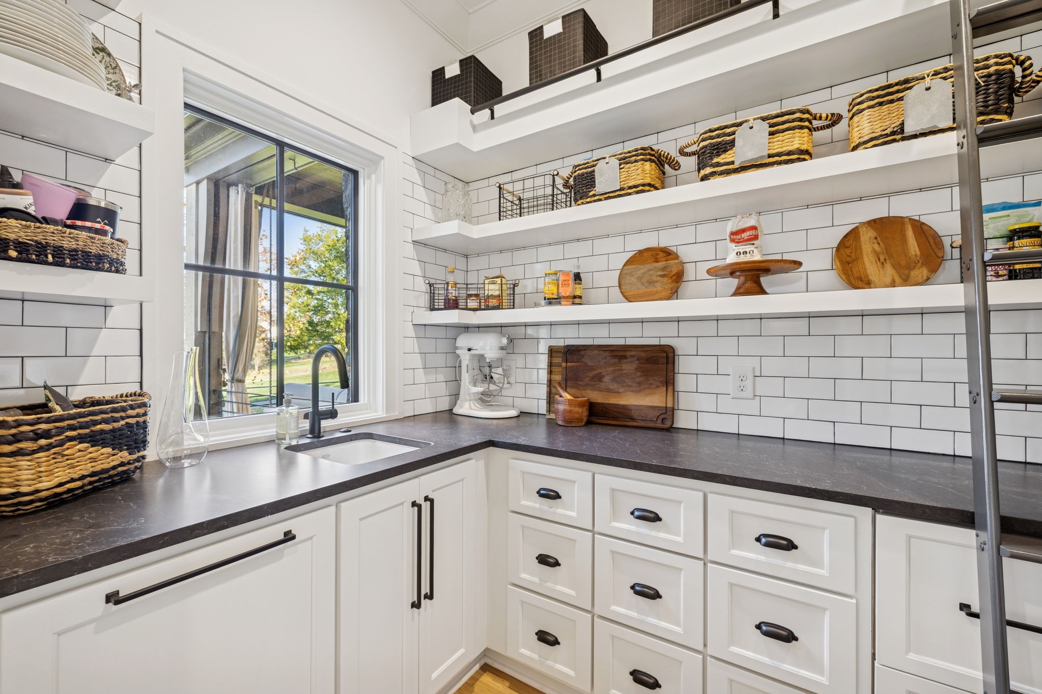7573 Whiskey Road College Grove, TN 37046 - Photo 24 of 100 a kitchen with stainless steel appliances cabinets a window and a sink