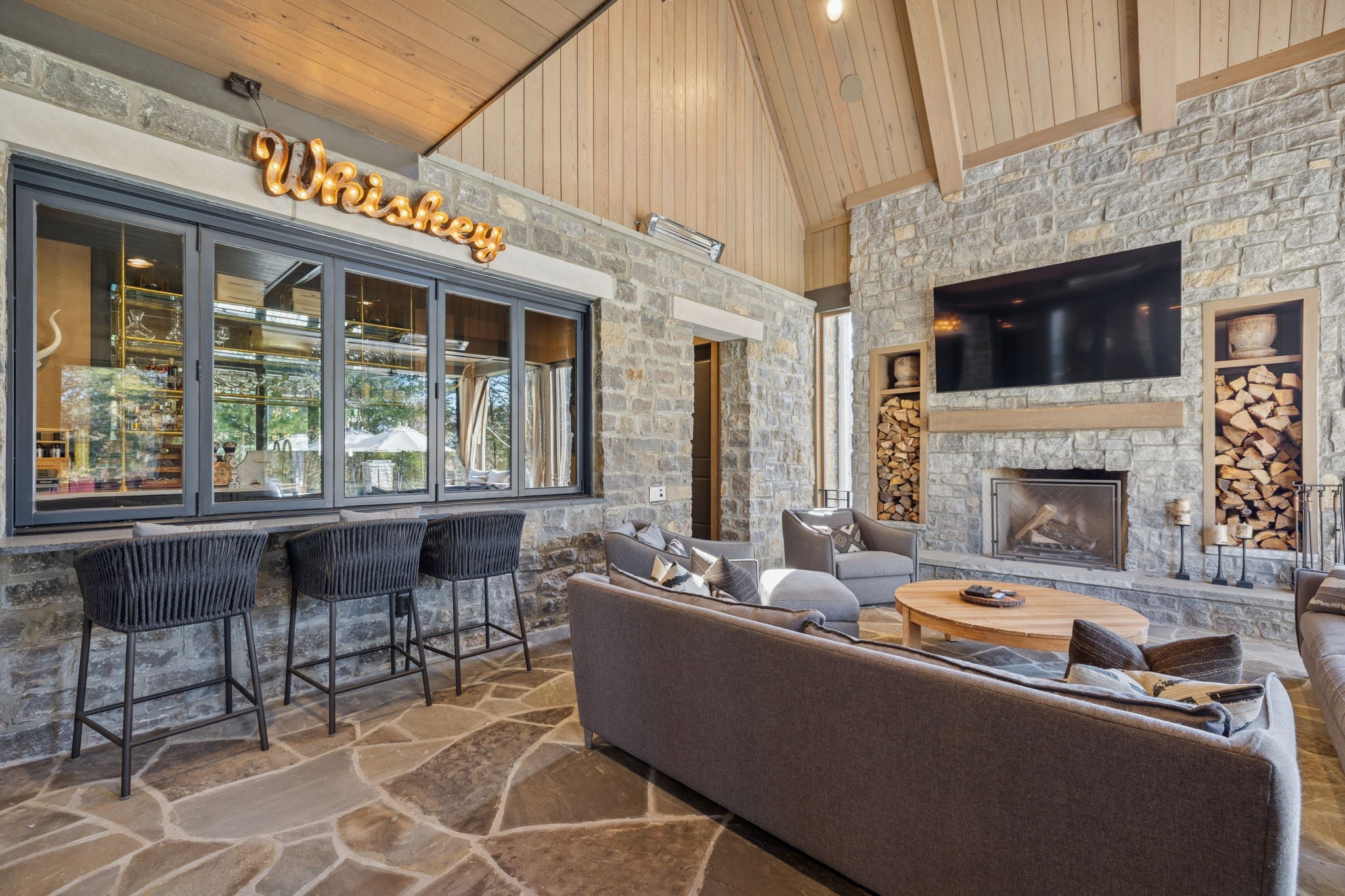 7573 Whiskey Road College Grove, TN 37046 - Photo 70 of 100 a living room with furniture a fireplace and a floor to ceiling window