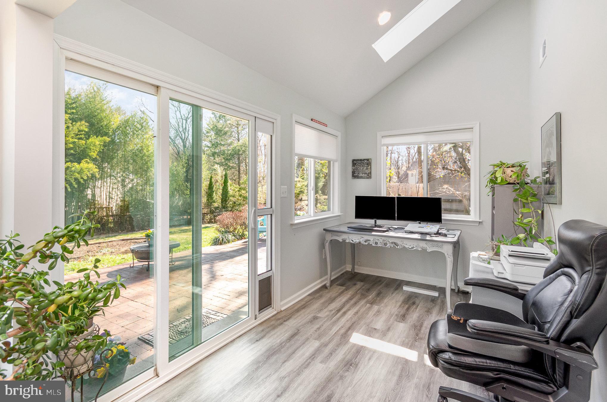6932 Spelman Drive Springfield, VA 22153 - Photo 12 of 37 a living room with furniture large windows and wooden floor