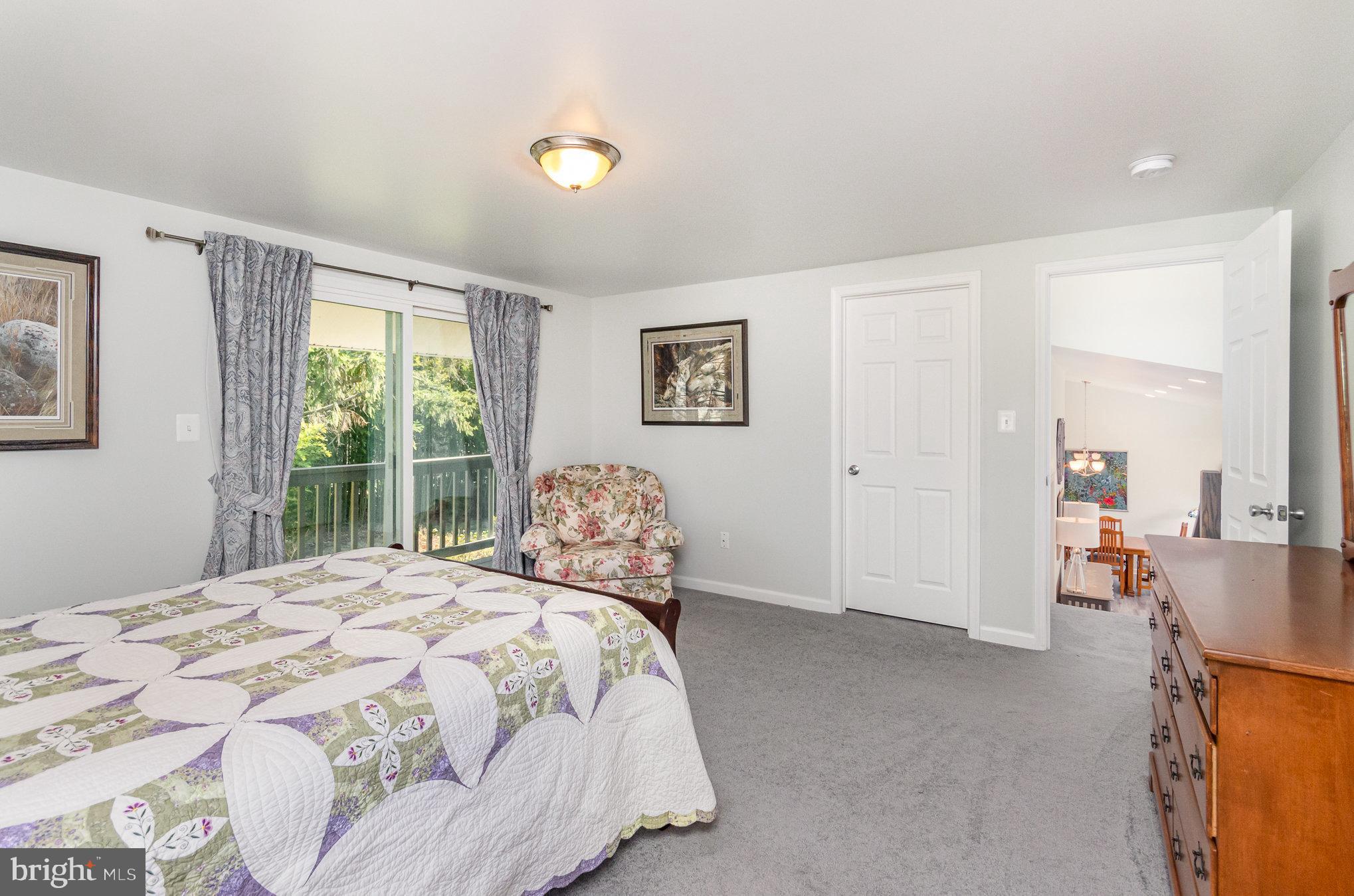 6932 Spelman Drive Springfield, VA 22153 - Photo 18 of 37 a bedroom with a bed and a window