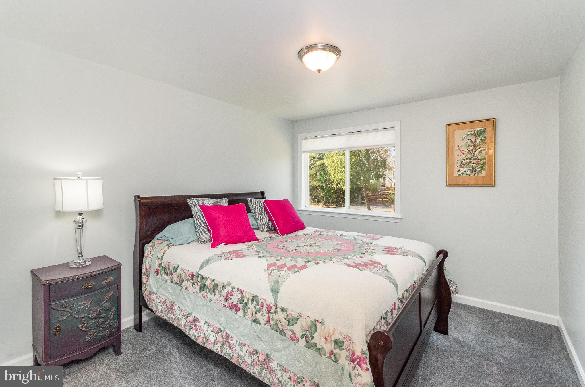 6932 Spelman Drive Springfield, VA 22153 - Photo 20 of 37 a bedroom with a bed and a window