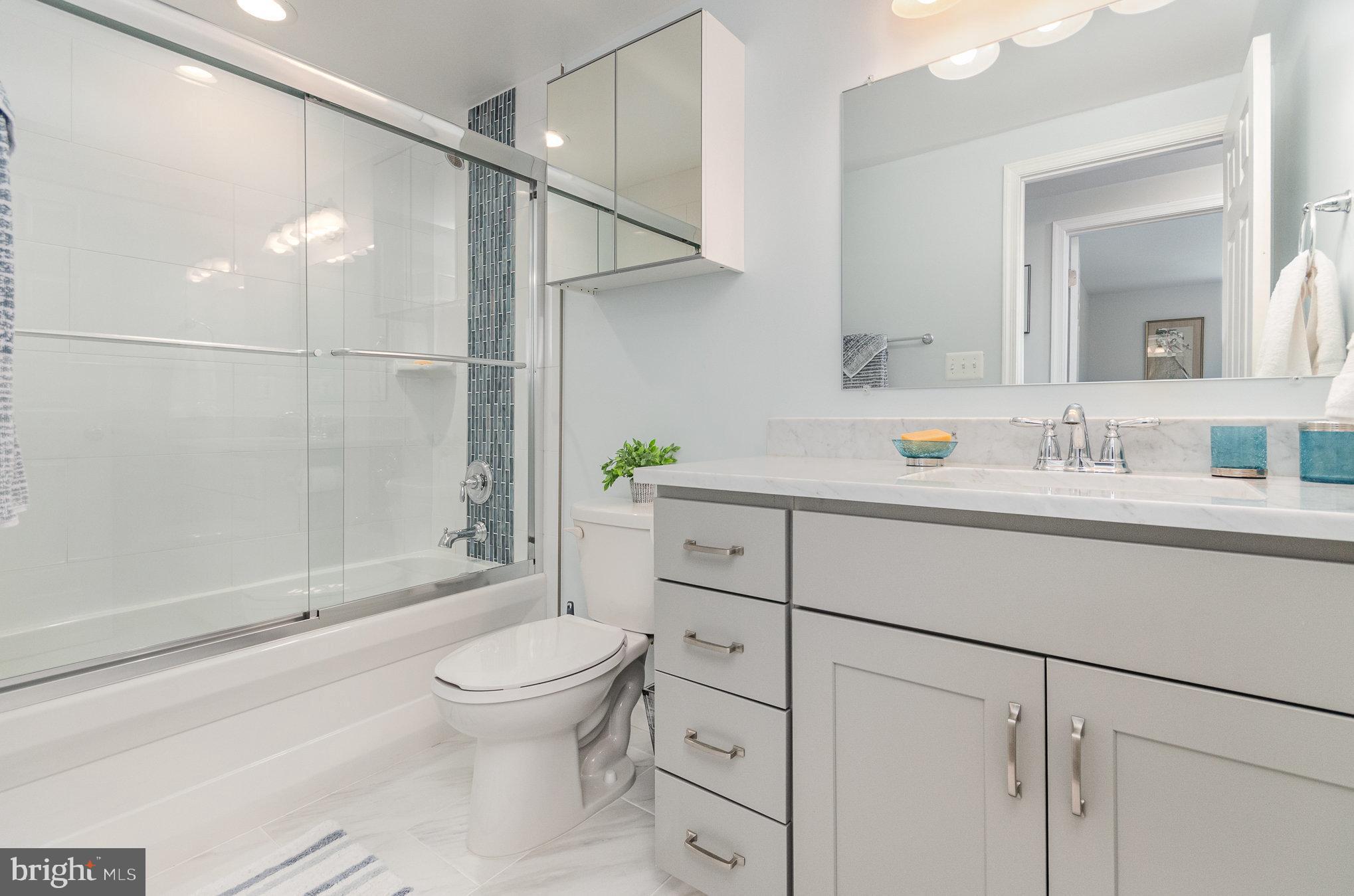 6932 Spelman Drive Springfield, VA 22153 - Photo 22 of 37 a bathroom with a sink a toilet and shower
