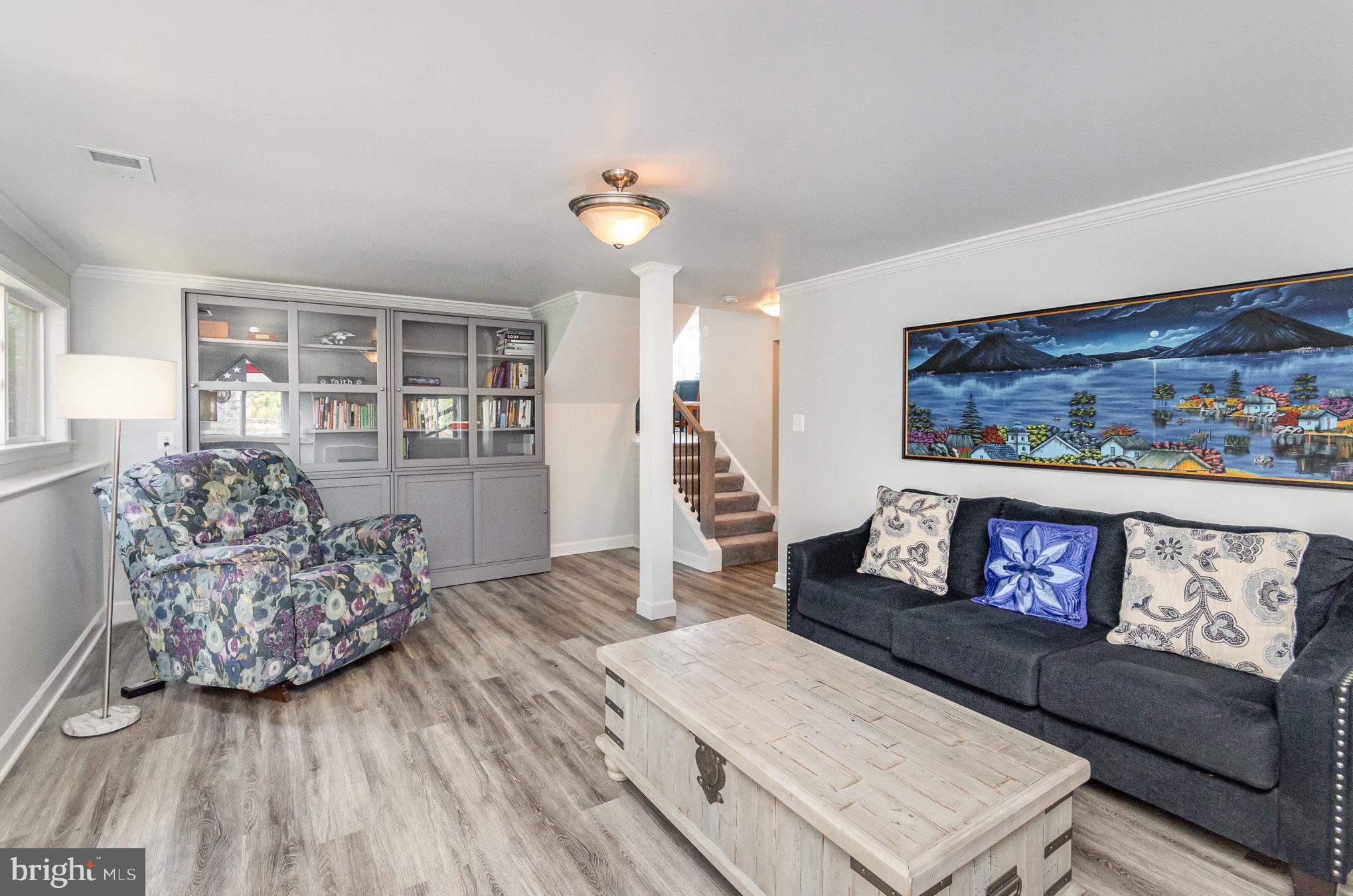 6932 Spelman Drive Springfield, VA 22153 - Photo 25 of 37 a living room with furniture and wooden floor