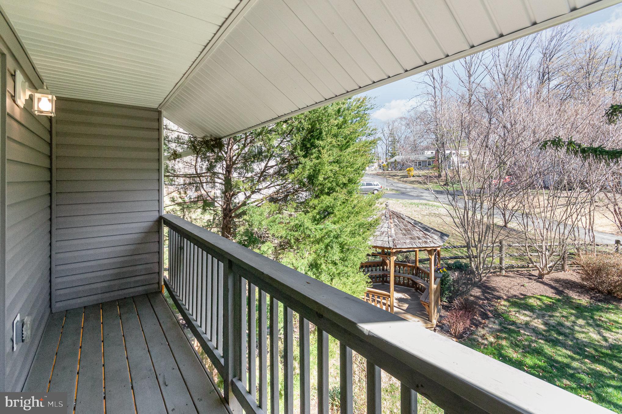 6932 Spelman Drive Springfield, VA 22153 - Photo 29 of 37 a view of a balcony with wooden fence