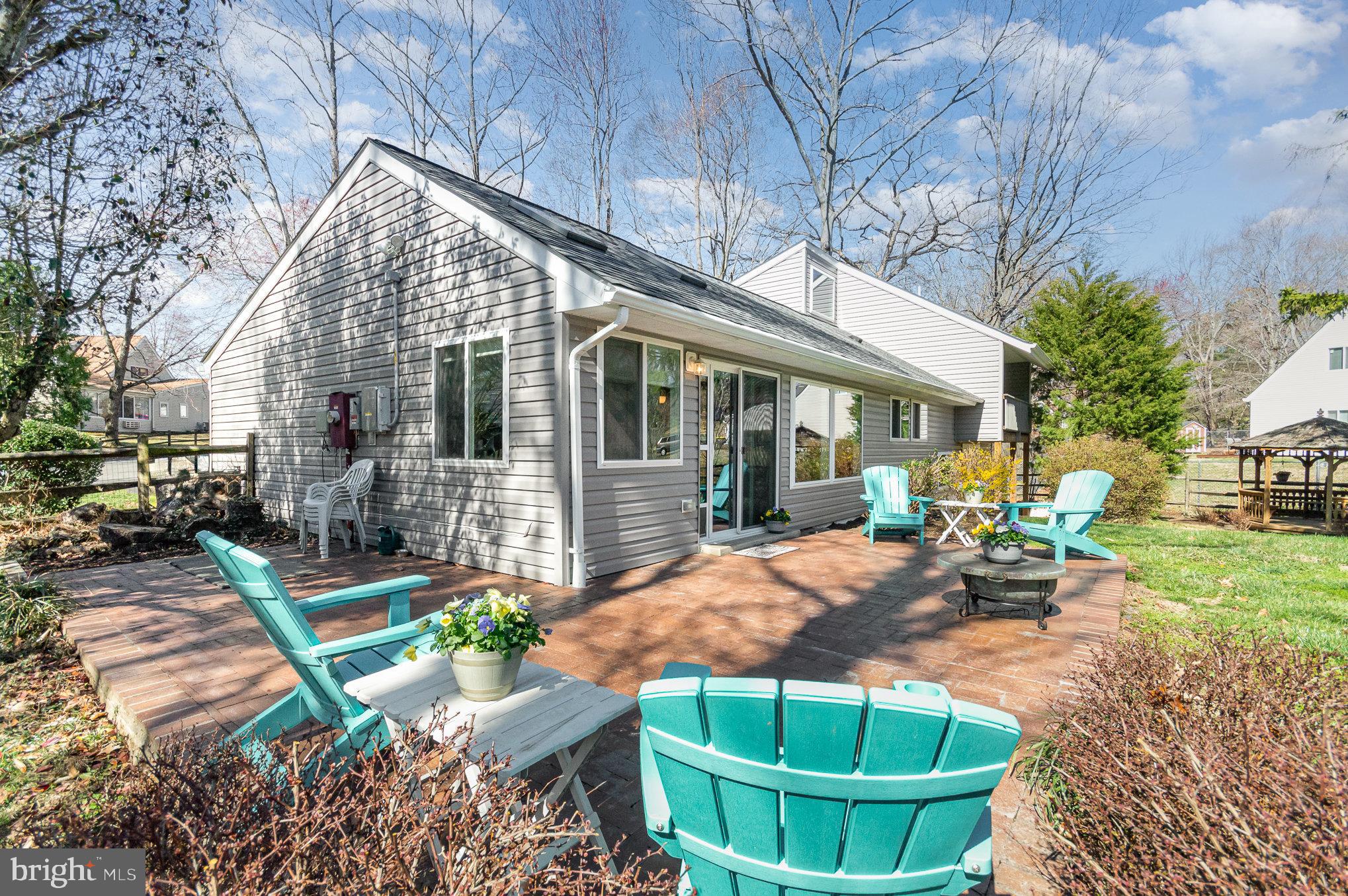 6932 Spelman Drive Springfield, VA 22153 - Photo 31 of 37 a view of a house with backyard porch and sitting area