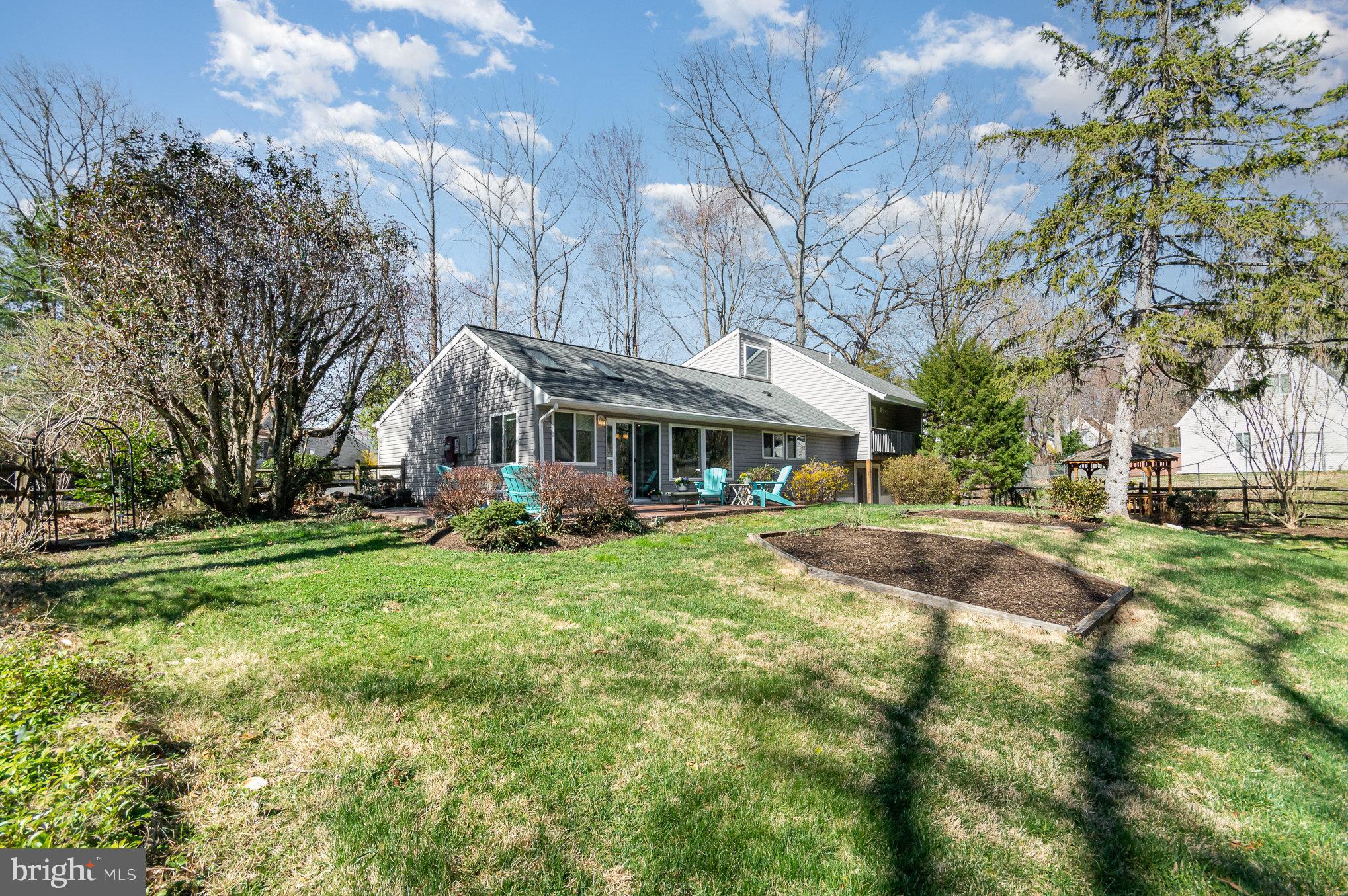 6932 Spelman Drive Springfield, VA 22153 - Photo 6 of 37 a view of a house with yard and sitting area