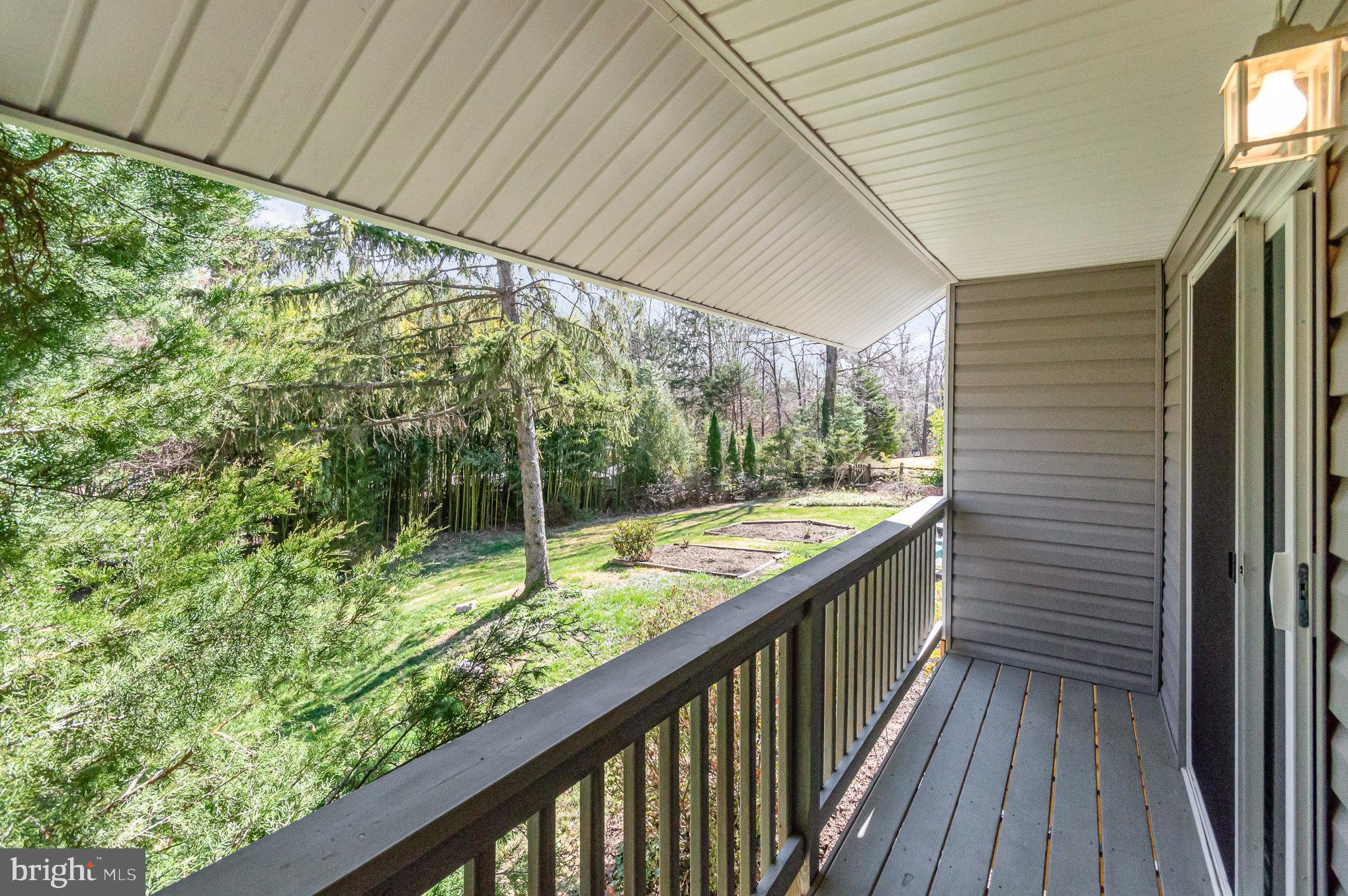 6932 Spelman Drive Springfield, VA 22153 - Photo 7 of 37 a view of balcony with wooden floor