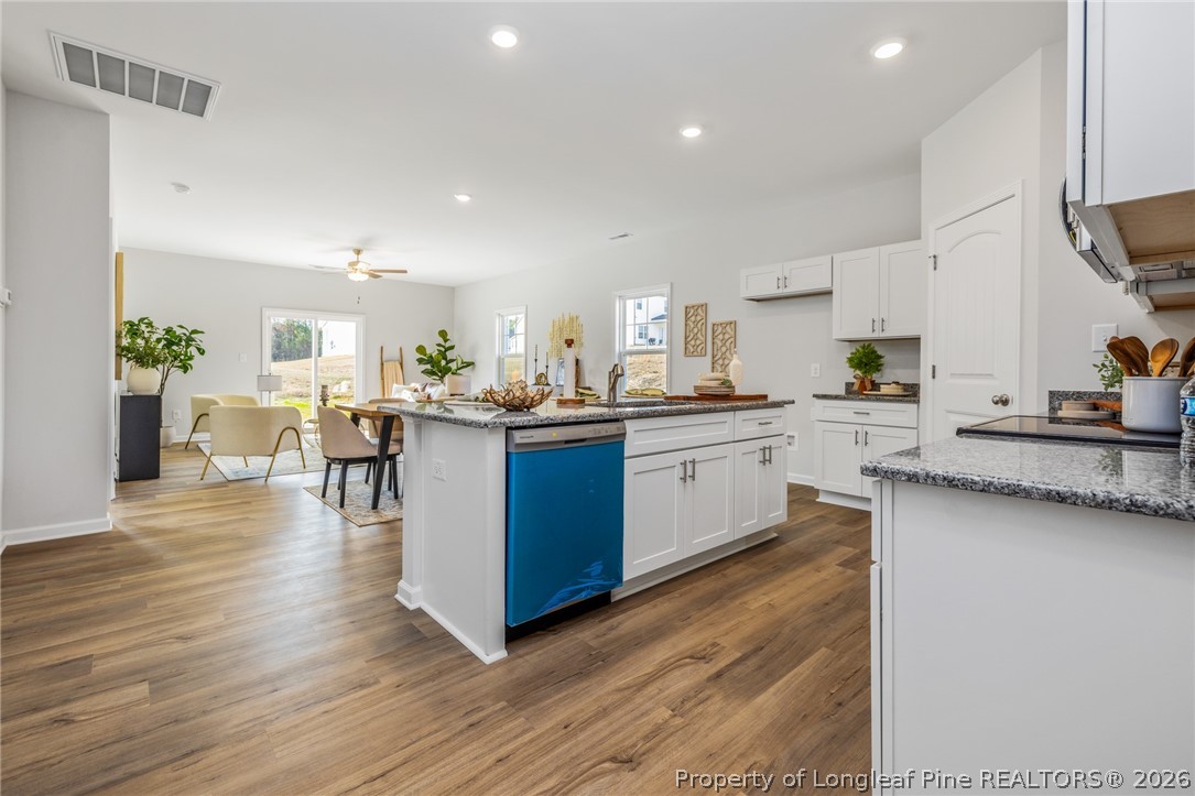 5421 Short Leaf (lot 109) Road Raeford, NC 28376 - Photo 13 of 29 a kitchen with a sink cabinets and wooden floor