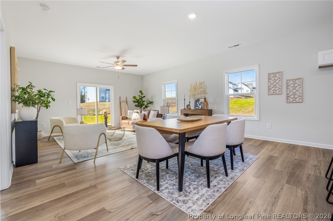 5421 Short Leaf (lot 109) Road Raeford, NC 28376 - Photo 16 of 29 a view of a dining room with furniture and wooden floor