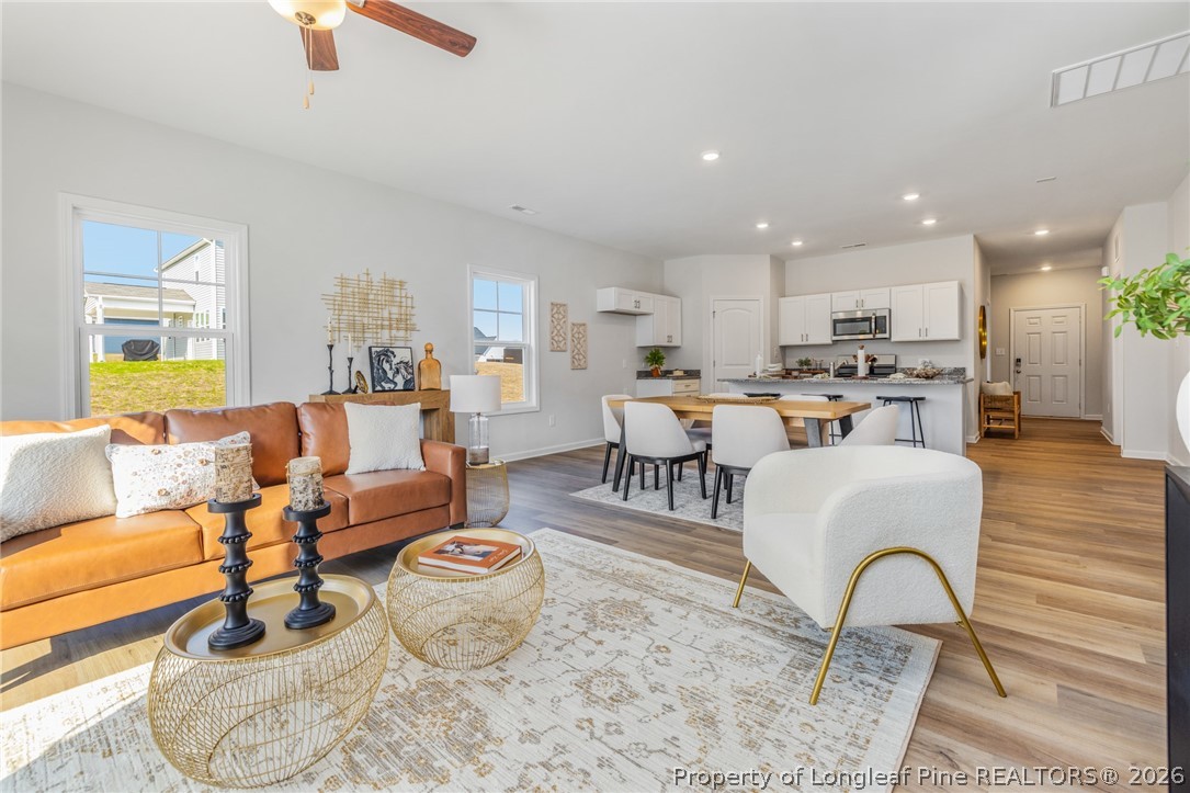 5421 Short Leaf (lot 109) Road Raeford, NC 28376 - Photo 18 of 29 a living room with furniture and a large window