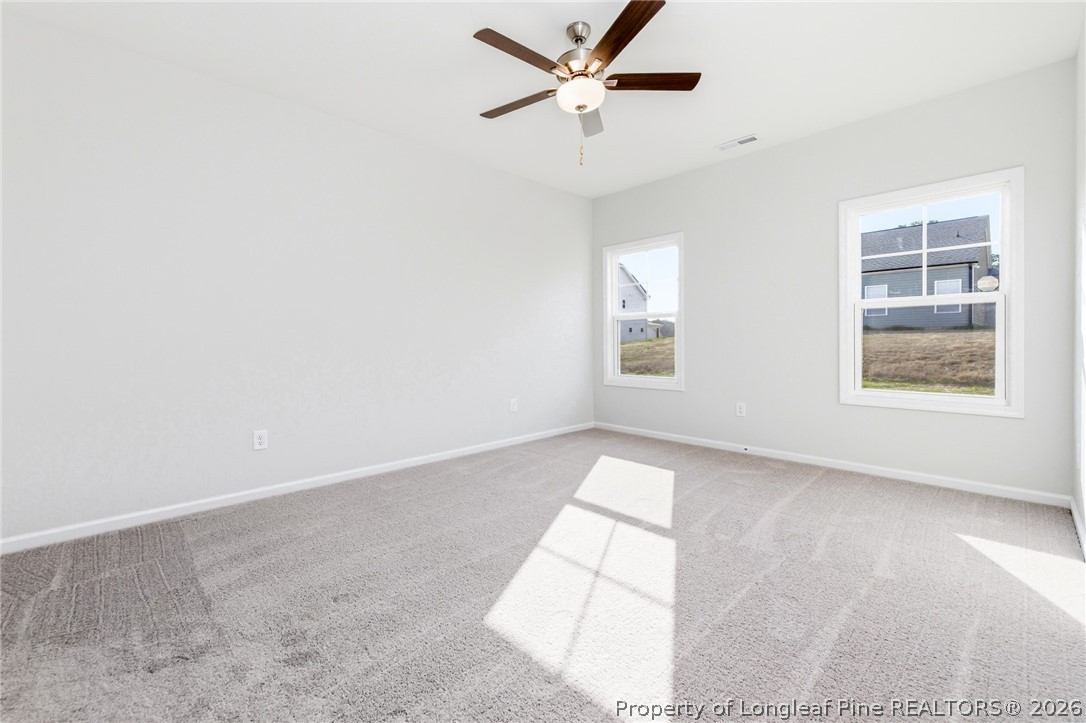 5421 Short Leaf (lot 109) Road Raeford, NC 28376 - Photo 21 of 29 an empty room with windows and fan