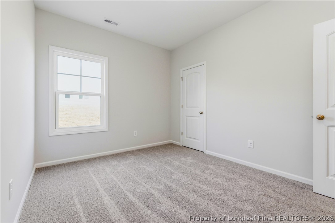 5421 Short Leaf (lot 109) Road Raeford, NC 28376 - Photo 7 of 29 an empty room with windows