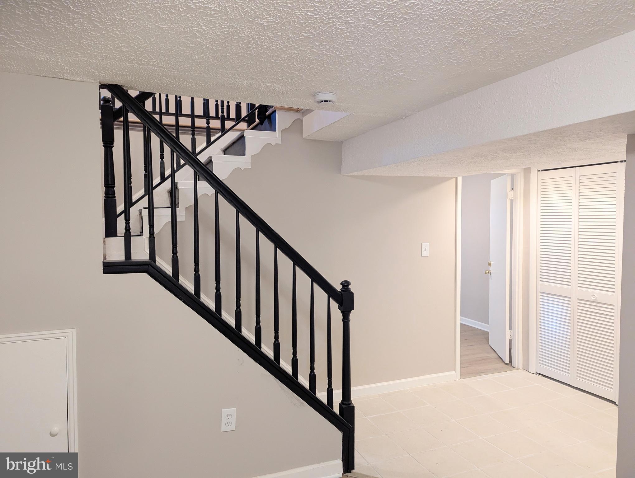 1712 Forestville Road Edgewater, MD 21037 - Photo 14 of 31 a view of a hallway with stairs