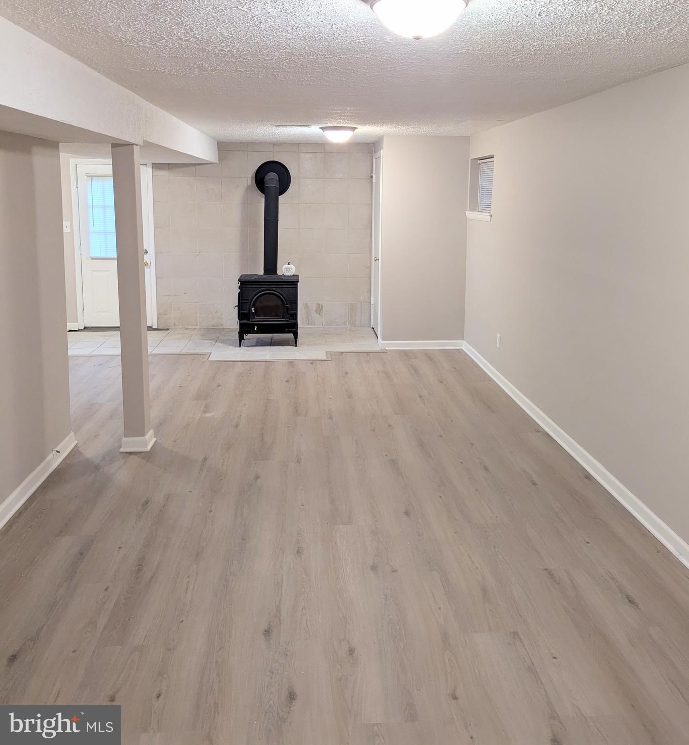 1712 Forestville Road Edgewater, MD 21037 - Photo 17 of 31 a hallway with wooden floor