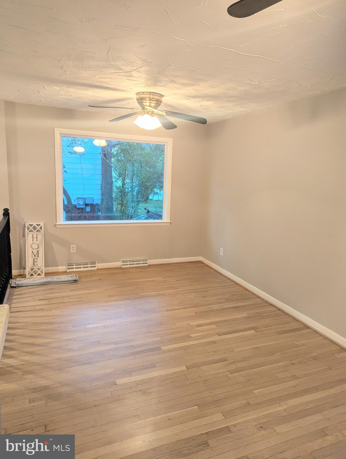 1712 Forestville Road Edgewater, MD 21037 - Photo 5 of 31 a view of a room with wooden floor and a window