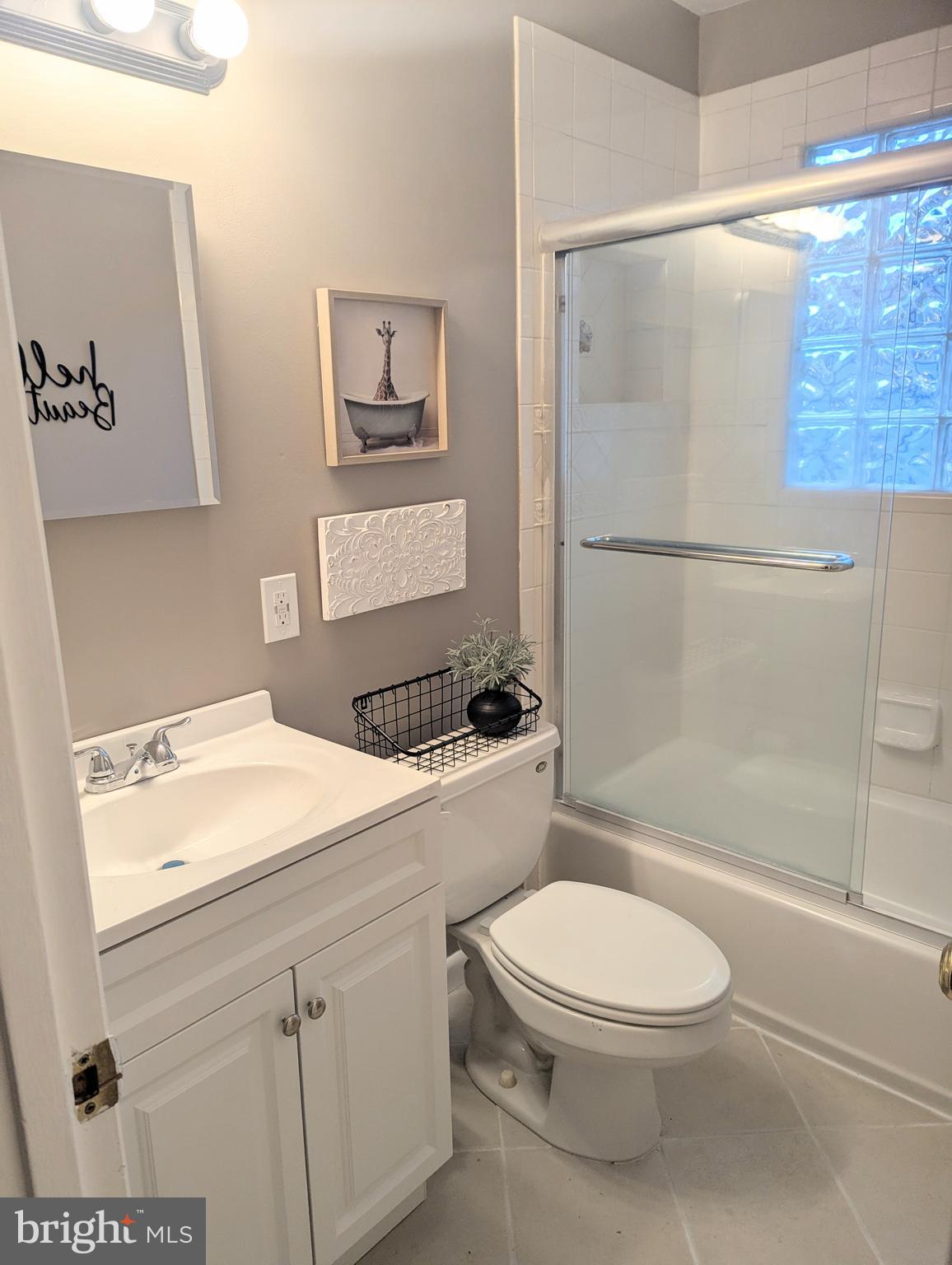 1712 Forestville Road Edgewater, MD 21037 - Photo 9 of 31 a bathroom with a sink a toilet and shower