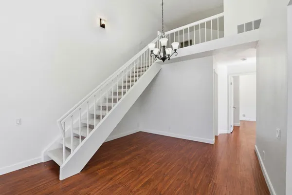 a view of entryway with wooden floor
