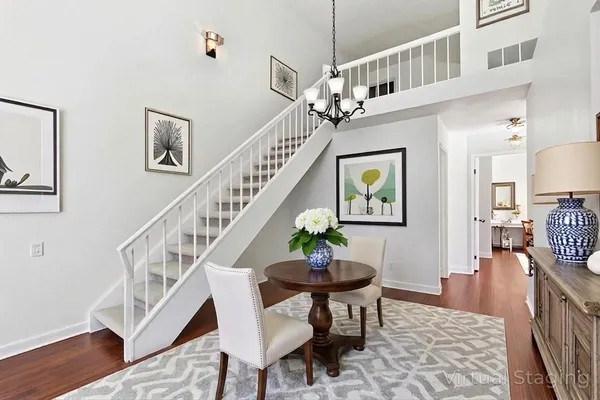 a view of entryway and hall with wooden floor