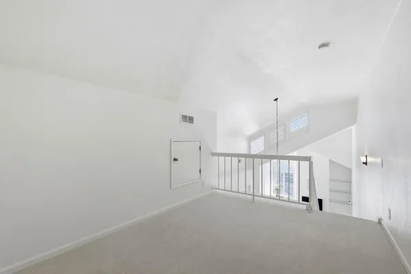 a view of a hallway with staircase