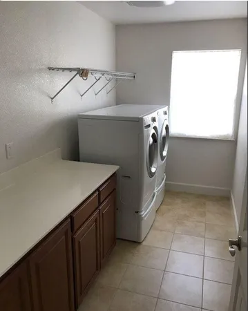 a utility room with cabinets