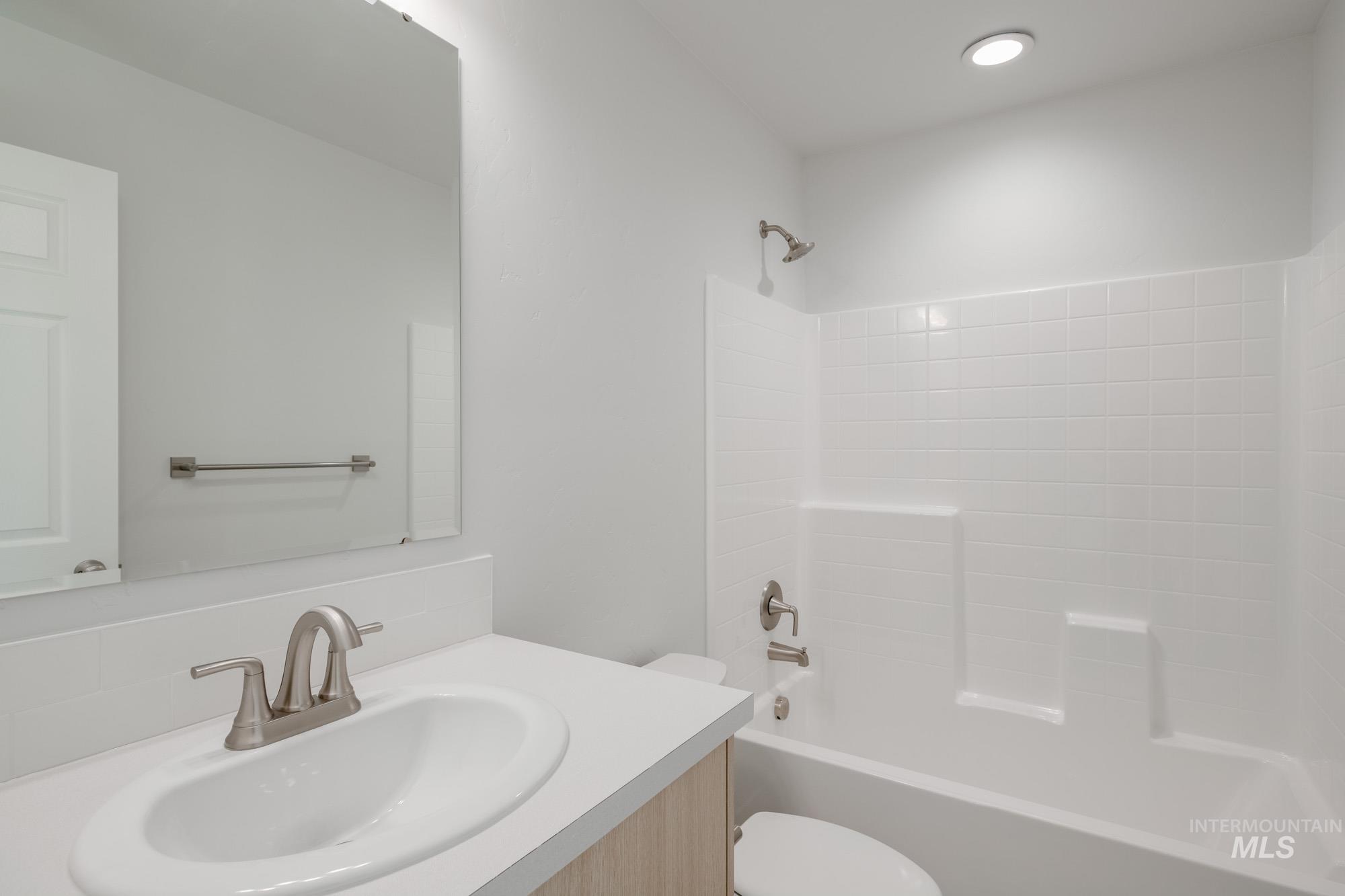 3310 South Maple Rnch Way Nampa, ID 83686 - Photo 11 of 19 Full bathroom featuring vanity and bathtub / shower combination