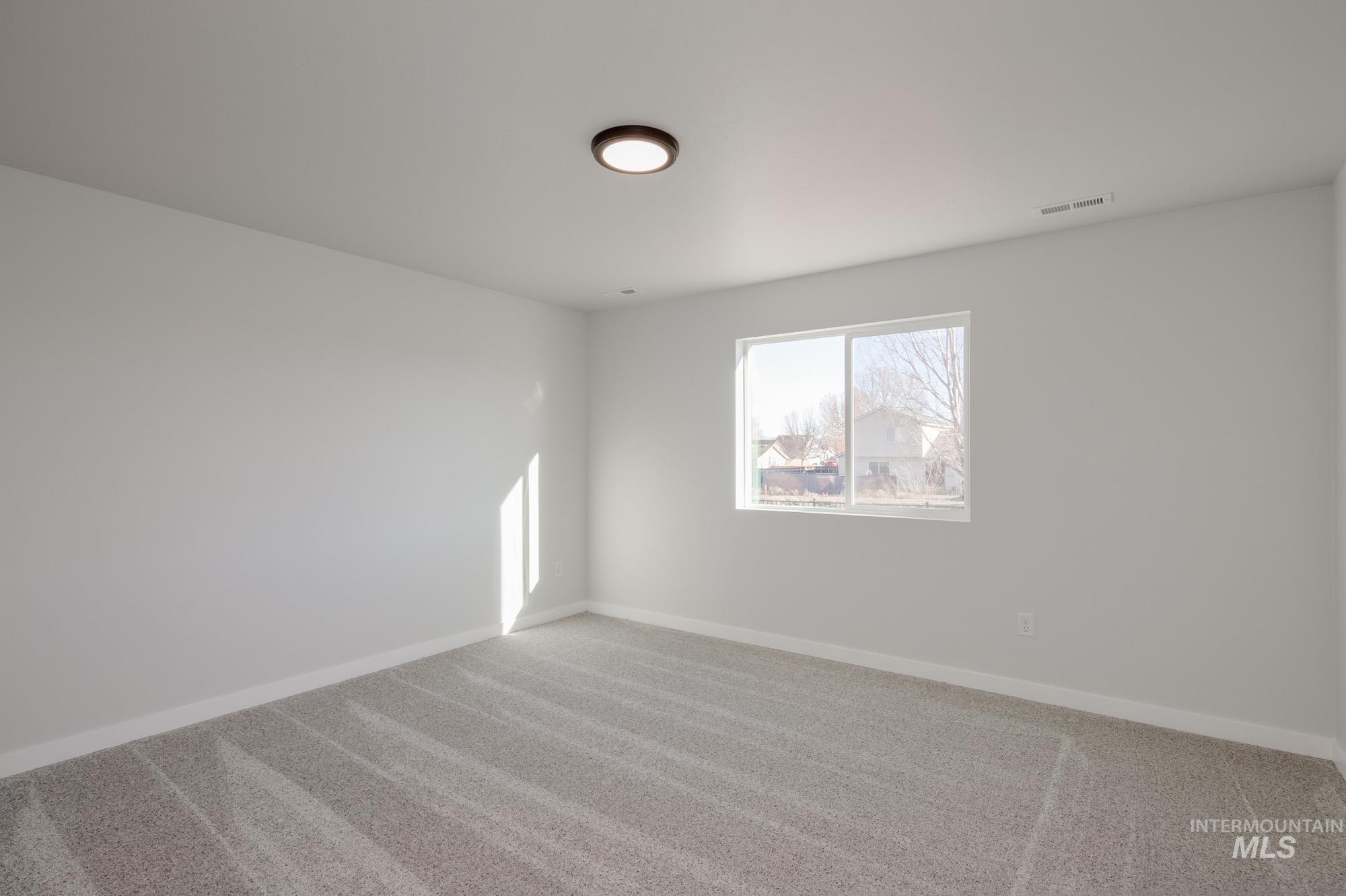 3310 South Maple Rnch Way Nampa, ID 83686 - Photo 14 of 19 Spare room with carpet